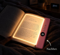 Kyrena Leselicht in Rosa auf aufgeschlagenem Buch im Bett